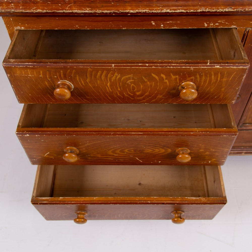 A Victorian scumble-painted pine kitchen dresser with three drawers, a cupboard door, turned knobs, and a galleried splashback shelf. View X