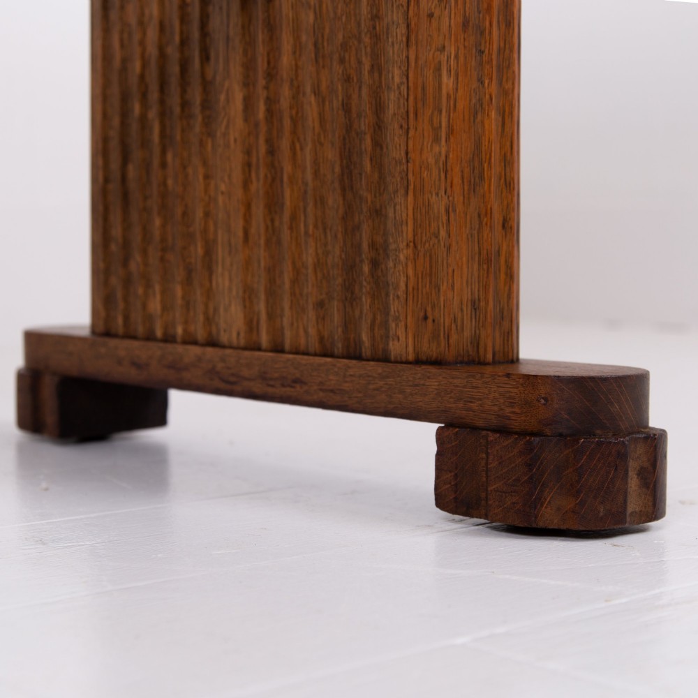 An Art Deco medium oak dining set comprising a rectangular pedestal table and four matching chairs with brown leather seats. View III