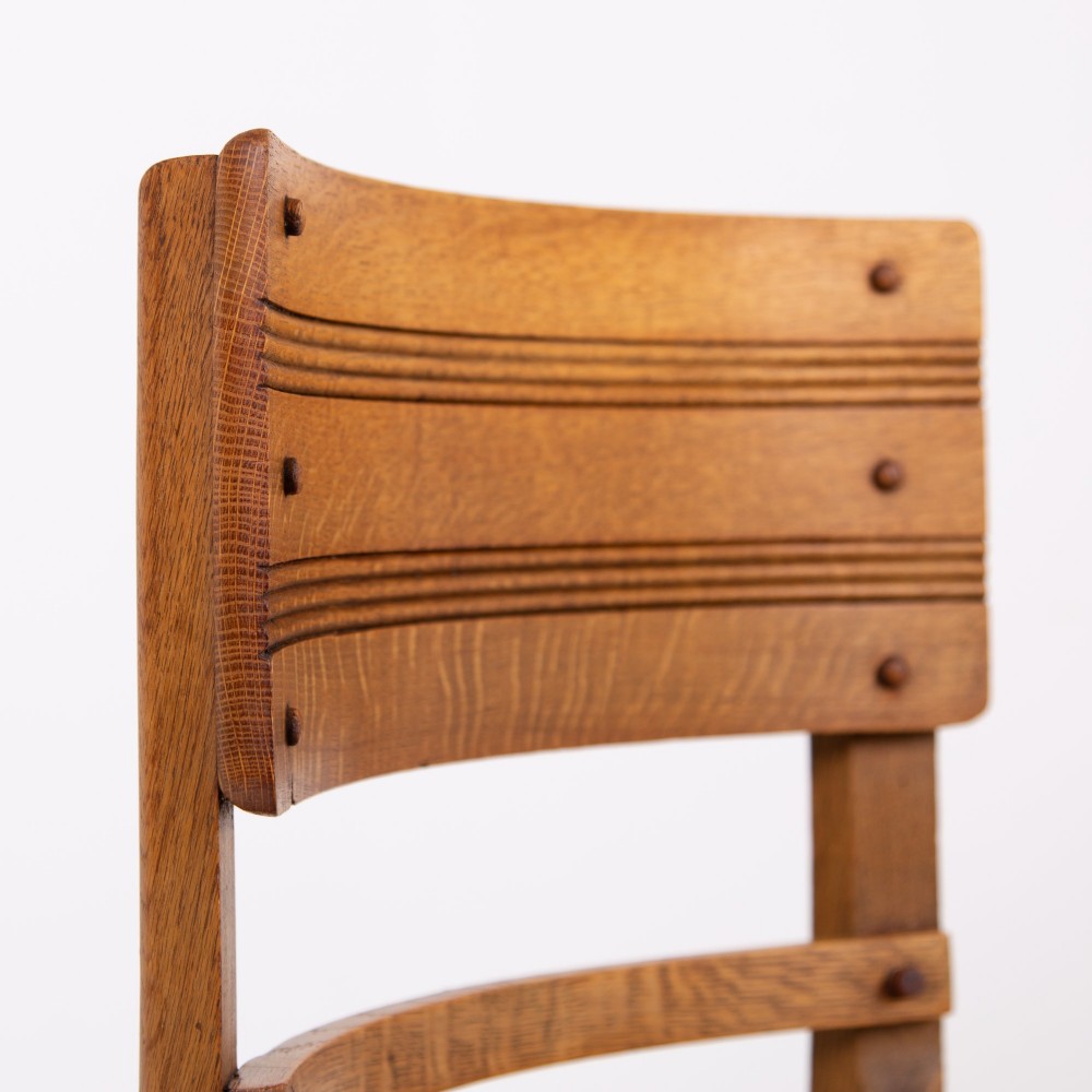 An Art Deco medium oak dining set comprising a rectangular pedestal table and four matching chairs with brown leather seats. View VII