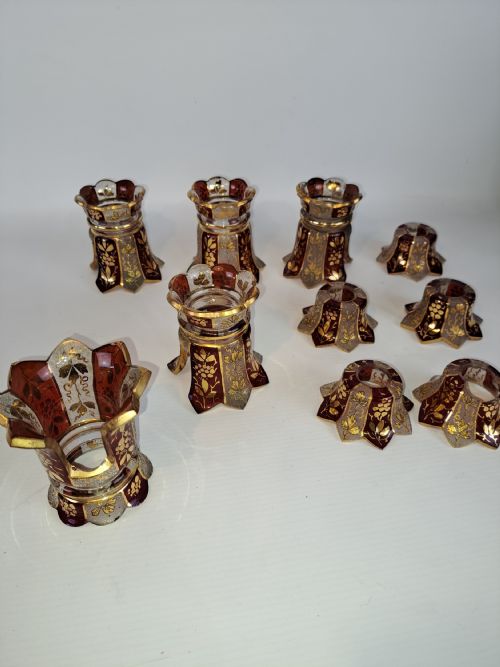 ASSORTMENT OF RUBY GLASS AND ETCHED GILDED CAPITALS
