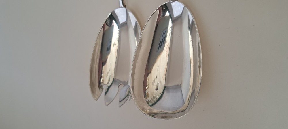 A circular cut crystal salad bowl with a silver rim, accompanied by a pair of silver and crystal-handled salad servers. View XI