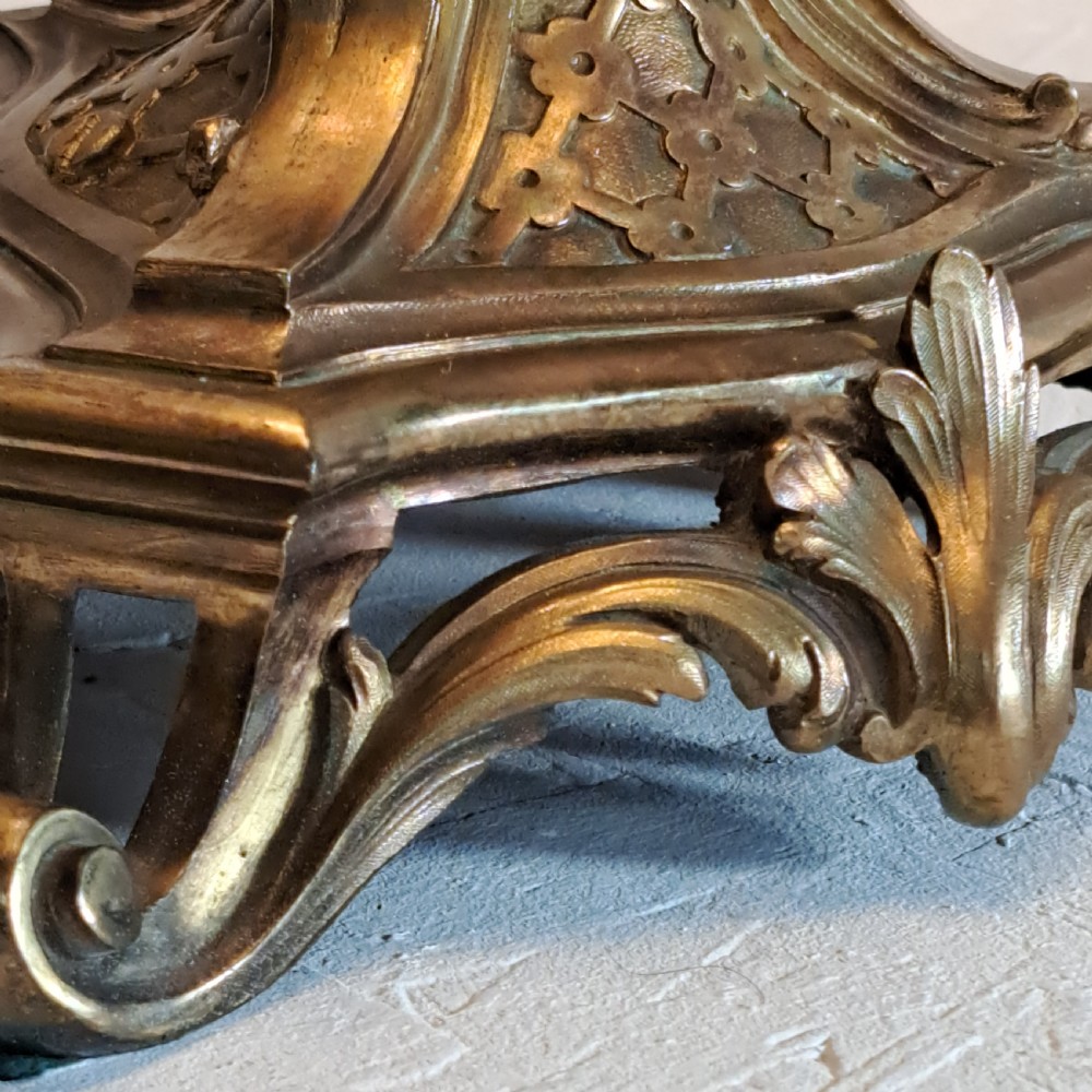 An ornate four-light gilt bronze candelabra table lamp in Rococo Revival style with flared fabric shades and cast scrollwork. View XIII