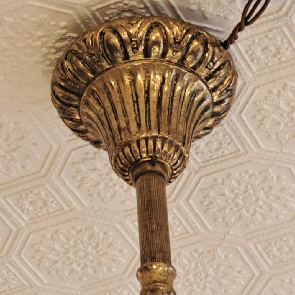 A multi-tiered antique crystal and gilt bronze electrolier chandelier with cascading prisms and candle-style bulb fittings. View XXVII