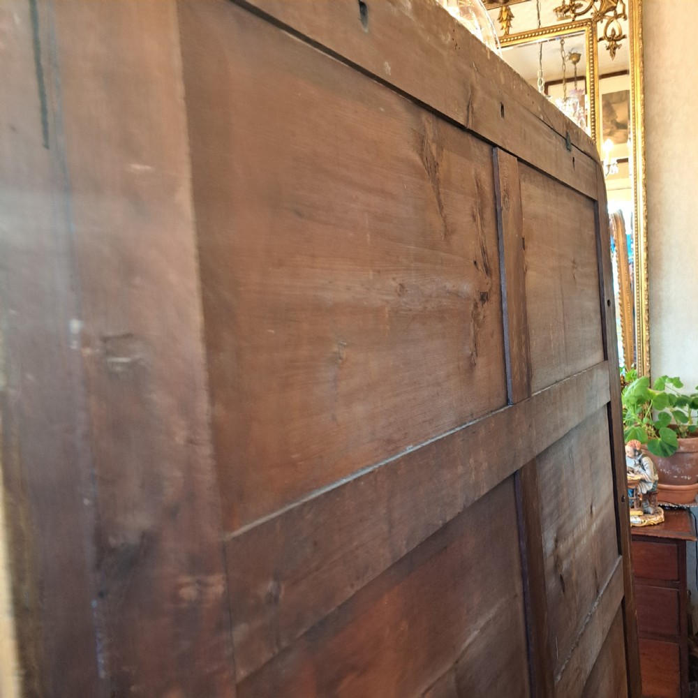 A large rectangular Georgian overmantel mirror featuring a rounded upper frame with gilded bead moulding and decorative foliate corner scrolls. View XV