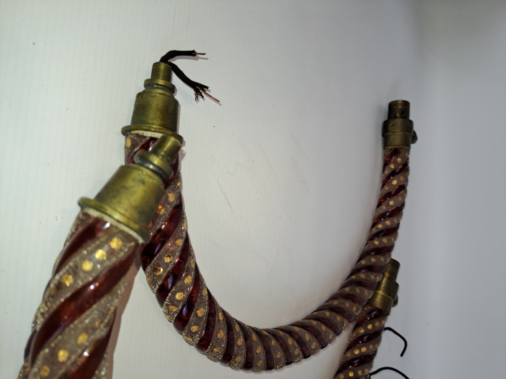 A set of four curved Bohemian ruby glass chandelier arms featuring twisted spiral patterns highlighted with gold enamelled dots and brass threaded mounts. View V