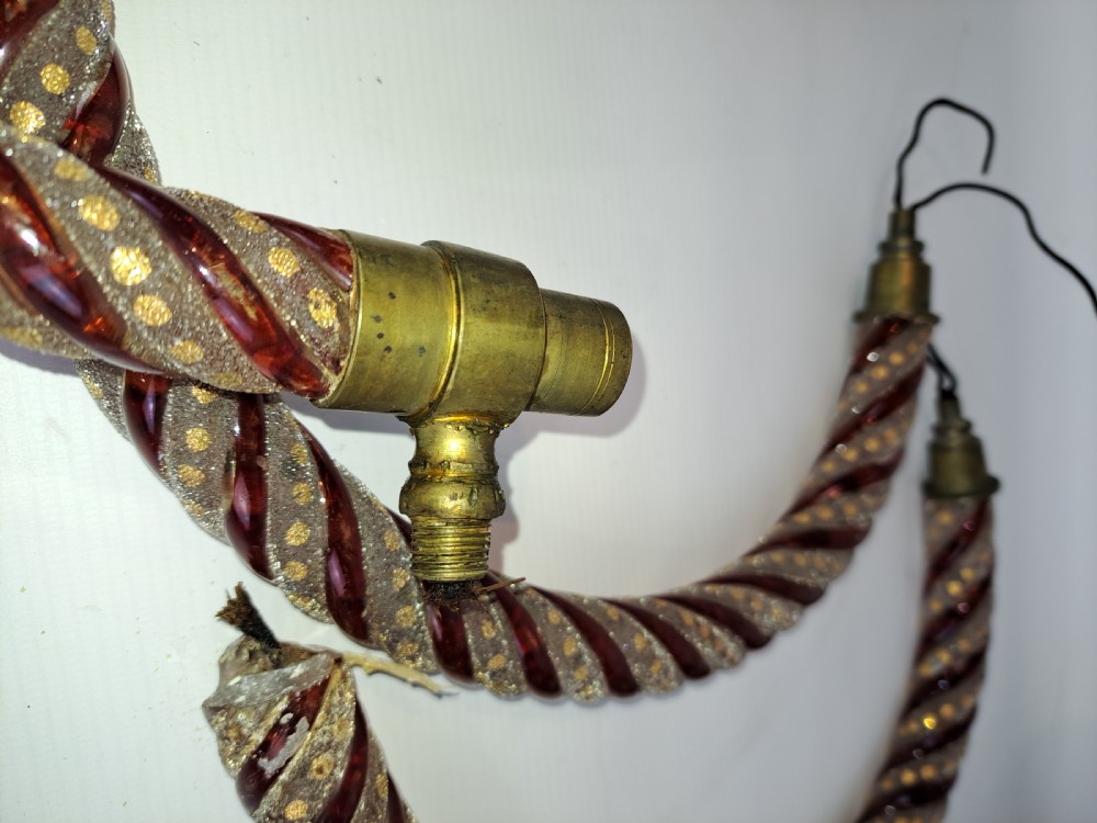 A set of four curved Bohemian ruby glass chandelier arms featuring twisted spiral patterns highlighted with gold enamelled dots and brass threaded mounts. View III