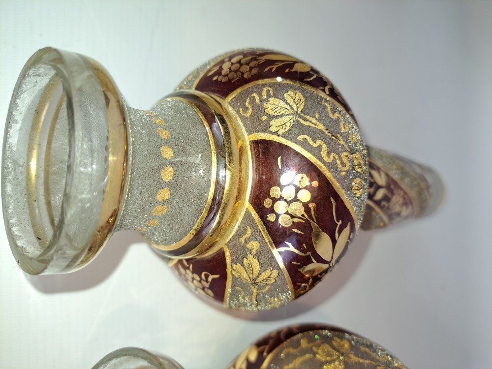 A pair of antique ruby red and frosted glass chandelier stems decorated with spiral gilt grapevine patterns. View VII