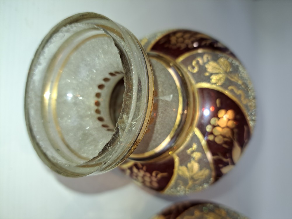 A pair of antique ruby red and frosted glass chandelier stems decorated with spiral gilt grapevine patterns. View VIII