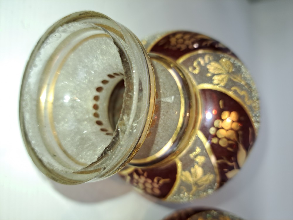 A pair of antique ruby red and frosted glass chandelier stems decorated with spiral gilt grapevine patterns. View IX