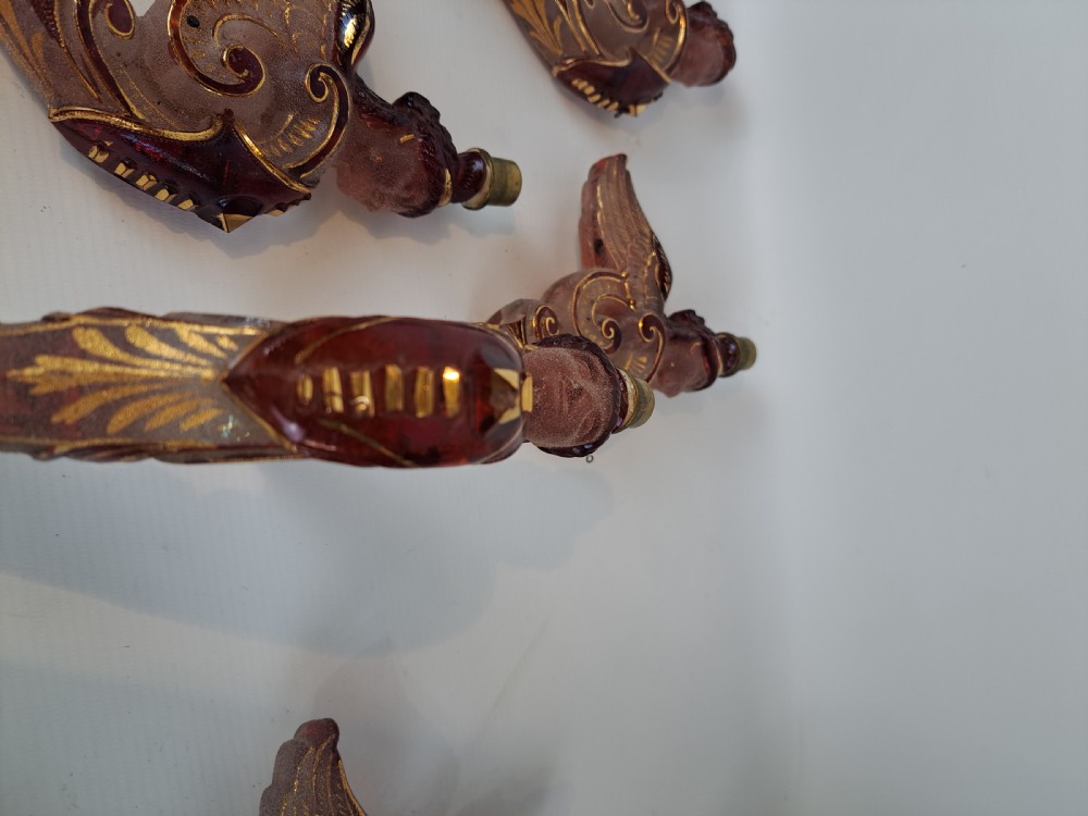 Set of five 19th-century Bohemian ruby and frosted glass chandelier arms shaped like winged forms with gilded scroll accents. View X