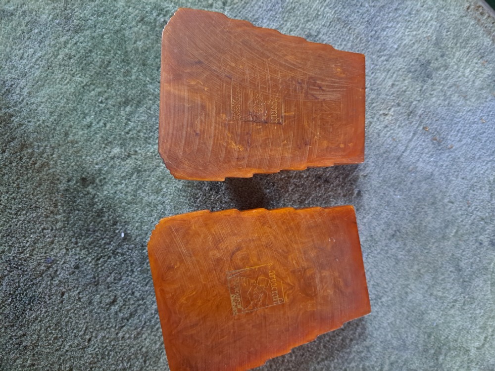 A pair of Art Deco amber phenolic resin stamp wetters featuring stepped side motifs and hollowed rectangular wells. View III