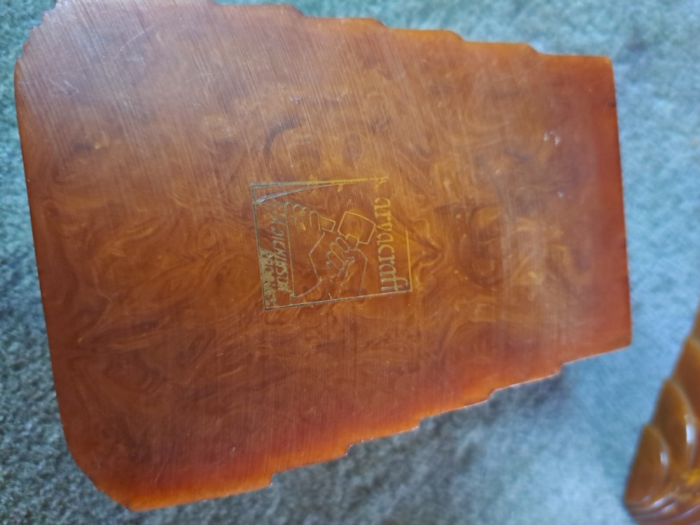 A pair of Art Deco amber phenolic resin stamp wetters featuring stepped side motifs and hollowed rectangular wells. View V