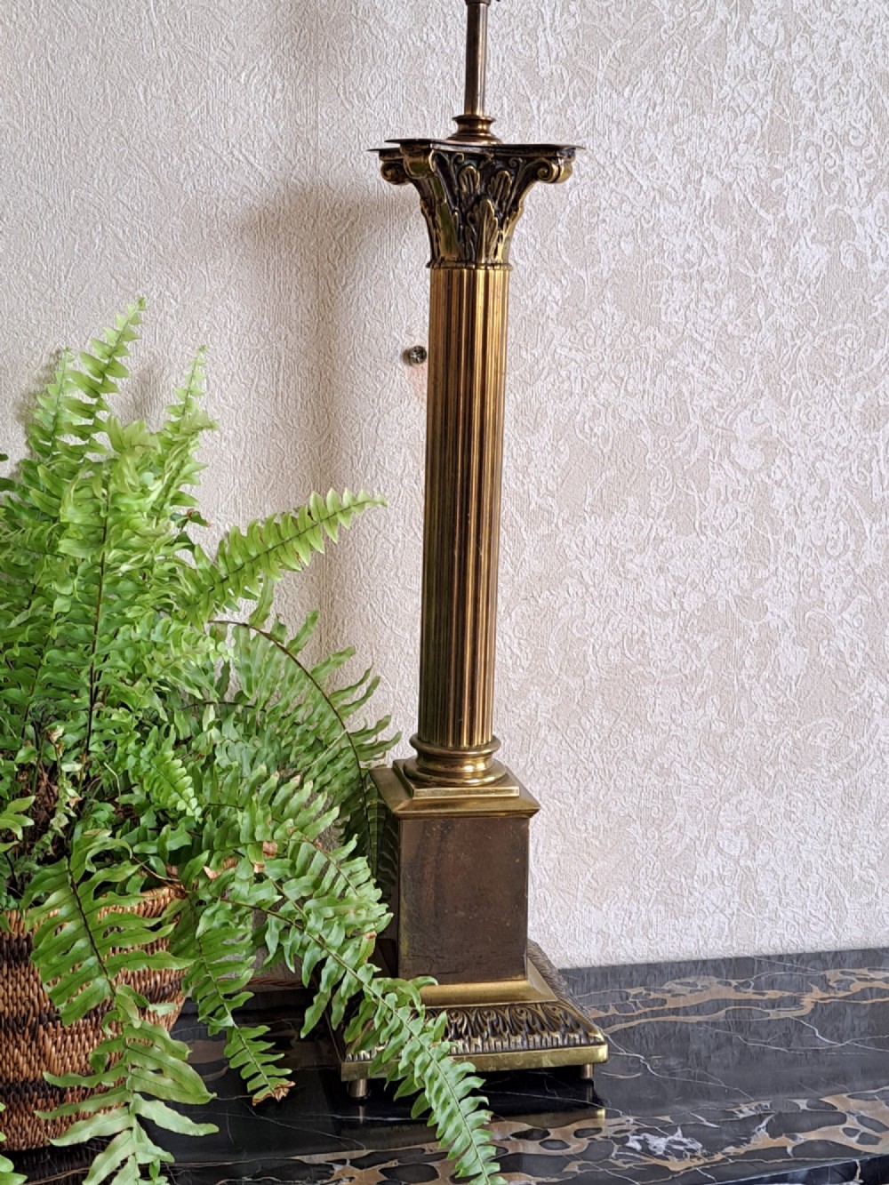 A brass table lamp designed as a classical Corinthian column with a fluted shaft and stepped square base. View XV