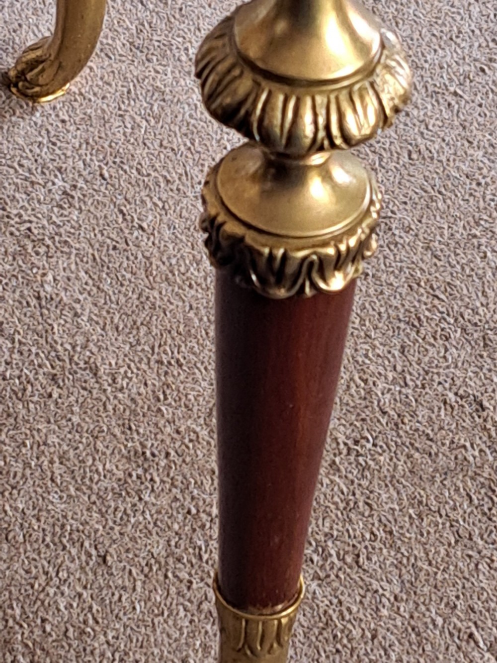 A rectangular coffee table featuring a dark veined marble top supported by tapered legs with ornamental brass mounts and brass feet. View VI