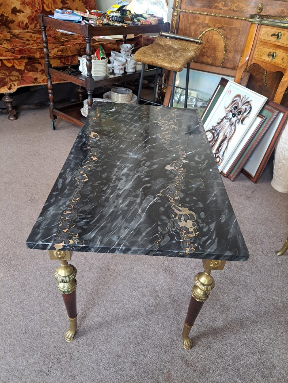 A rectangular coffee table featuring a dark veined marble top supported by tapered legs with ornamental brass mounts and brass feet. View IX
