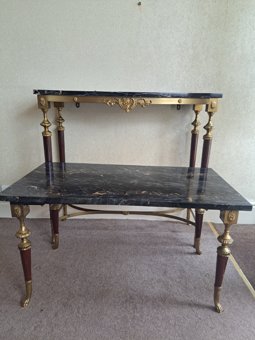 A rectangular coffee table featuring a dark veined marble top supported by tapered legs with ornamental brass mounts and brass feet. View XIII