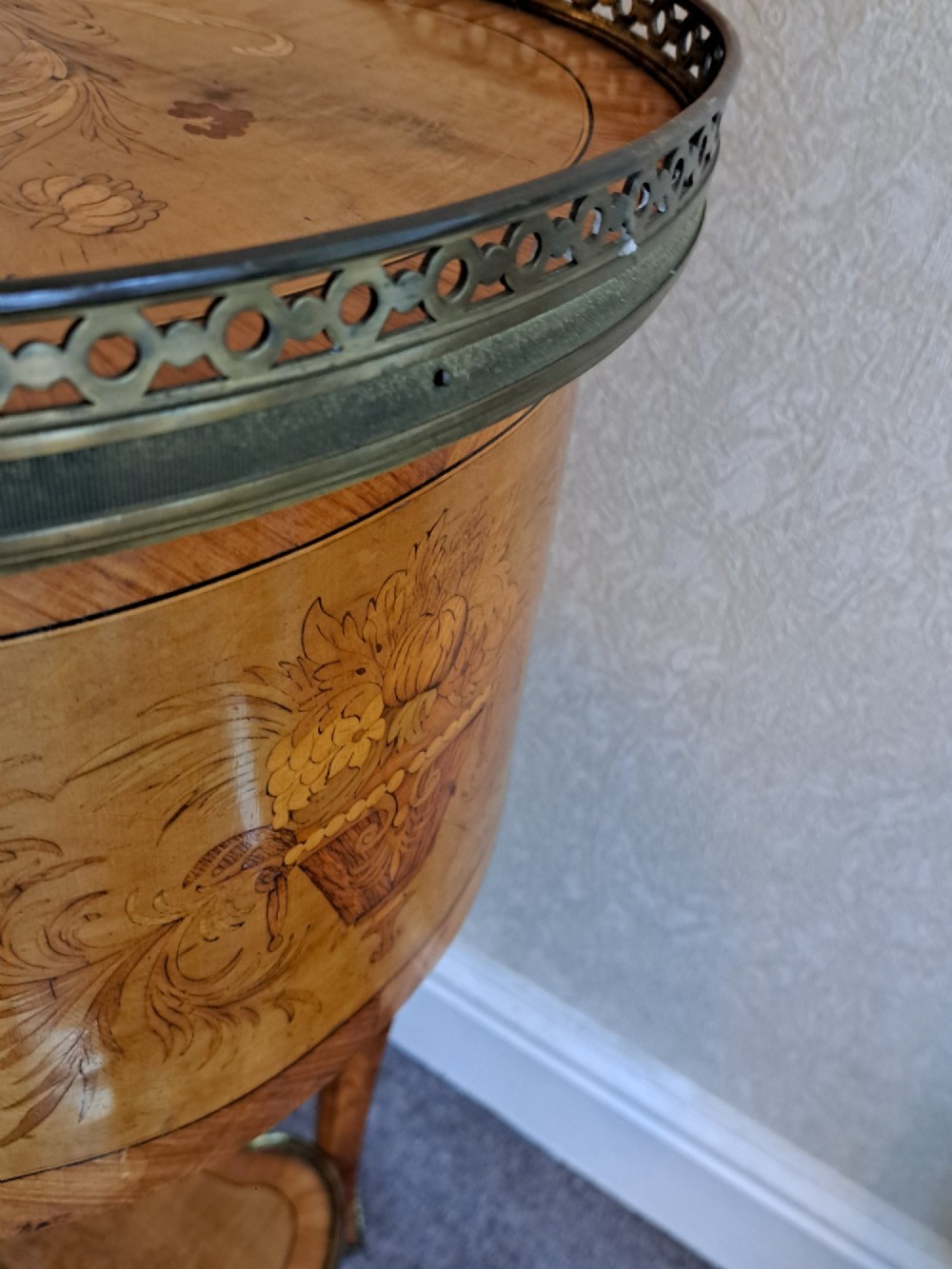 A kidney-shaped French marquetry side table featuring floral timber inlays, two drawers, a pierced brass gallery top, and a lower shelf. View V