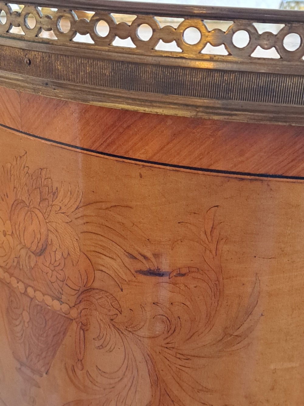 A kidney-shaped French marquetry side table featuring floral timber inlays, two drawers, a pierced brass gallery top, and a lower shelf. View VIII