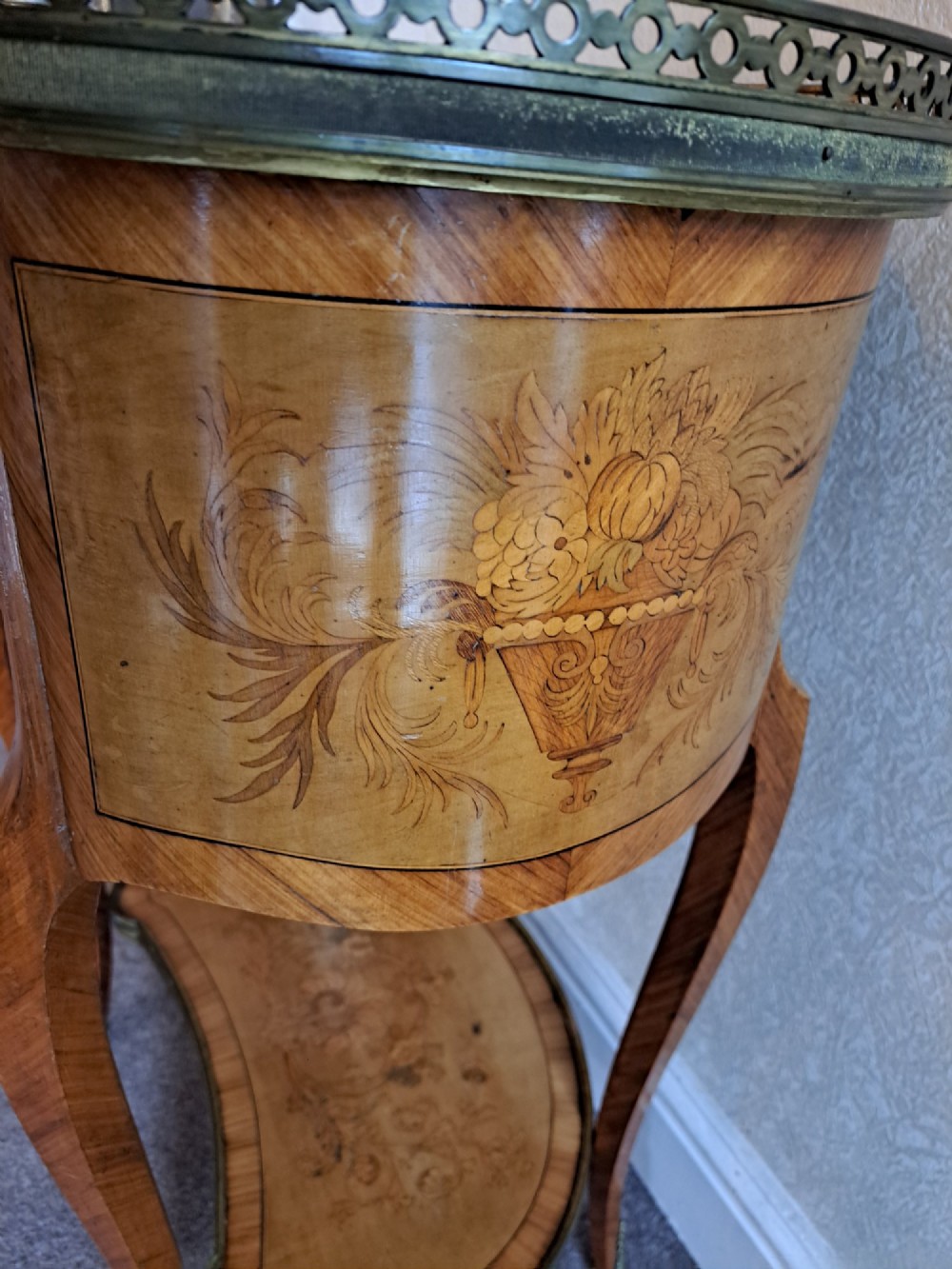 A kidney-shaped French marquetry side table featuring floral timber inlays, two drawers, a pierced brass gallery top, and a lower shelf. View IX