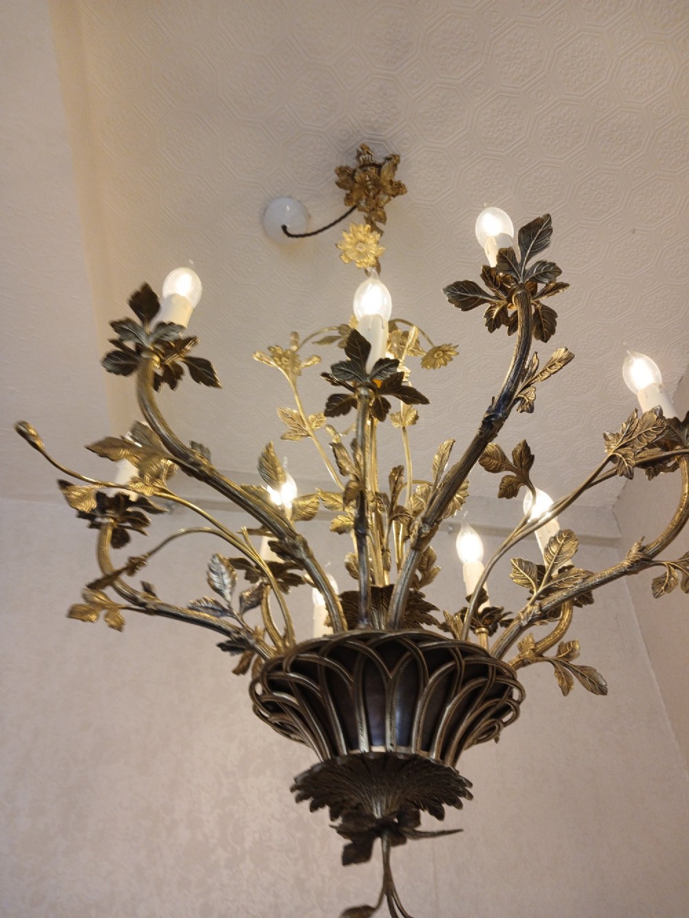 A French gilt bronze chandelier featuring leaf and floral motifs arranged in a basket form with candle bulb sockets. View III