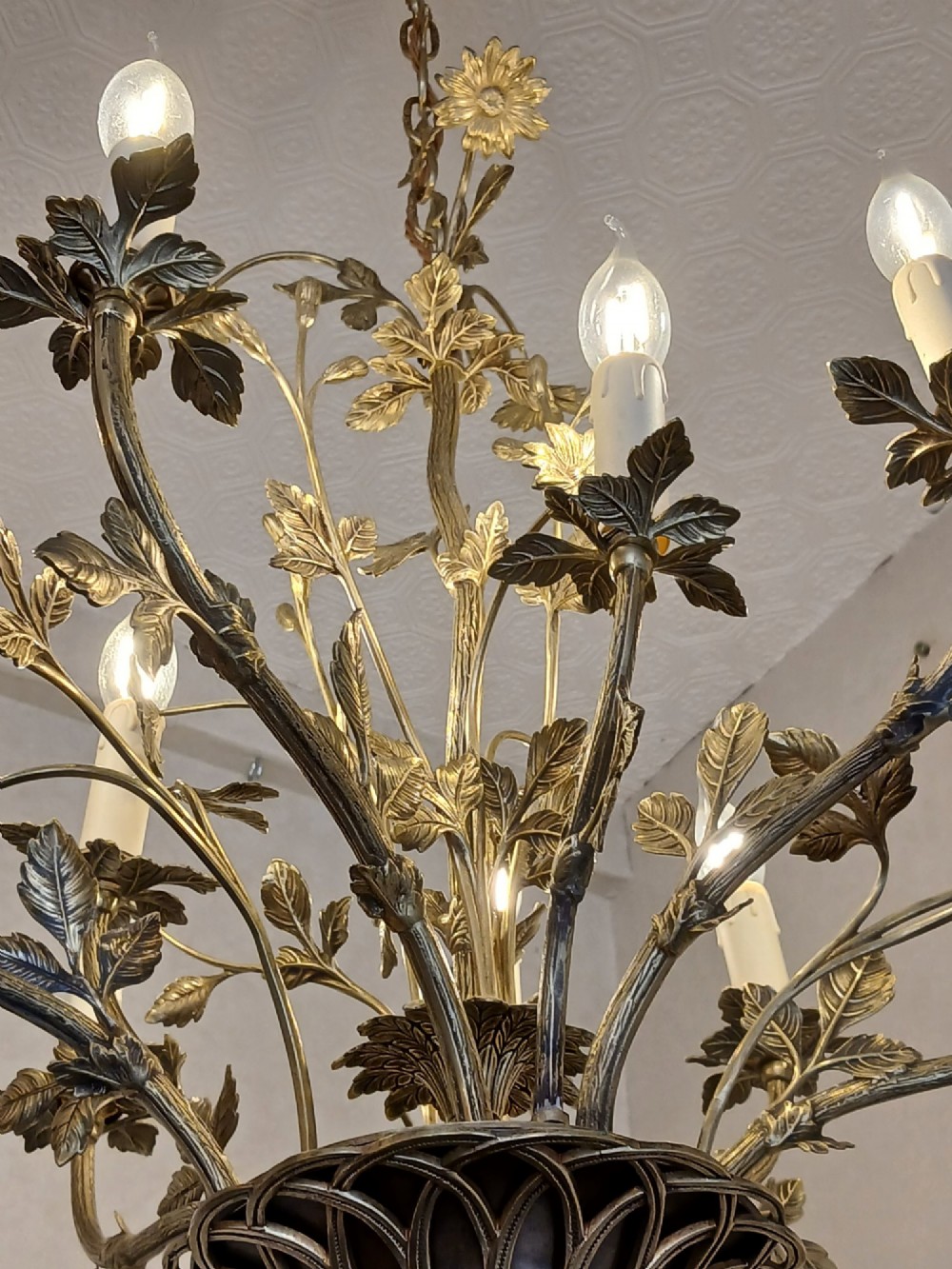A French gilt bronze chandelier featuring leaf and floral motifs arranged in a basket form with candle bulb sockets. View VI