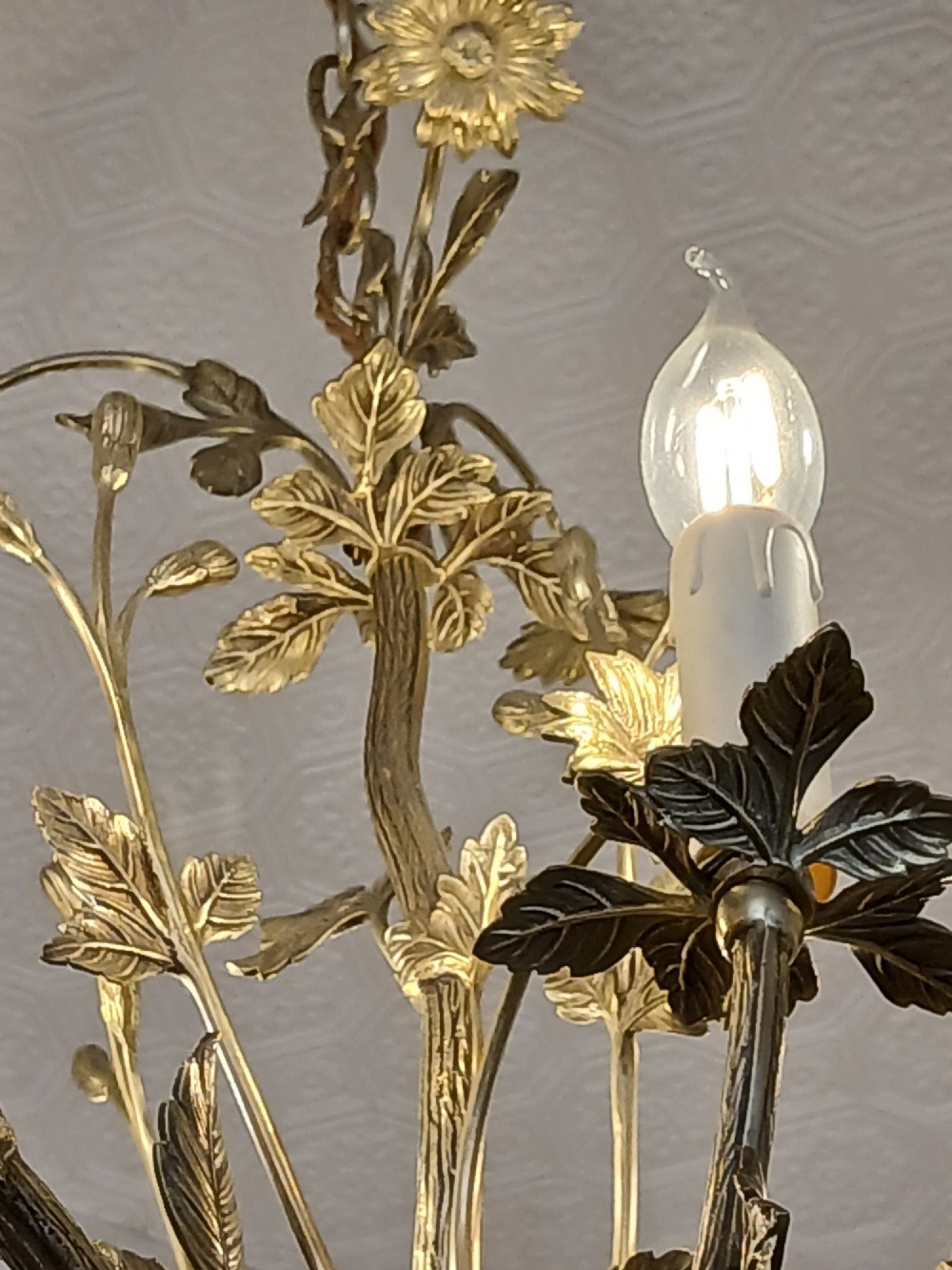 A French gilt bronze chandelier featuring leaf and floral motifs arranged in a basket form with candle bulb sockets. View X