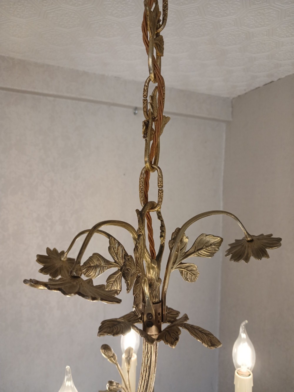 A French gilt bronze chandelier featuring leaf and floral motifs arranged in a basket form with candle bulb sockets. View XIV