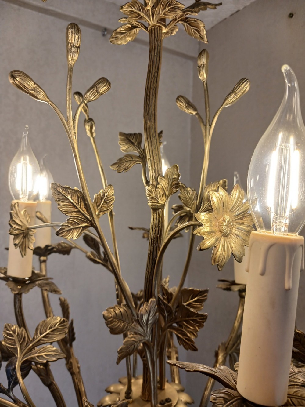 A French gilt bronze chandelier featuring leaf and floral motifs arranged in a basket form with candle bulb sockets. View XV