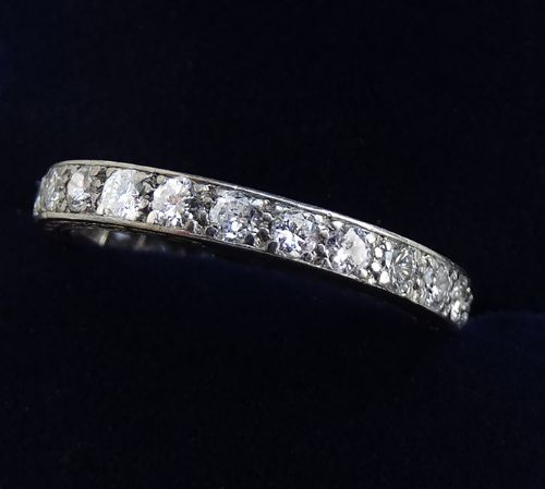 fig 1. An Art Deco platinum full eternity ring set with a continuous circle of round brilliant diamonds.