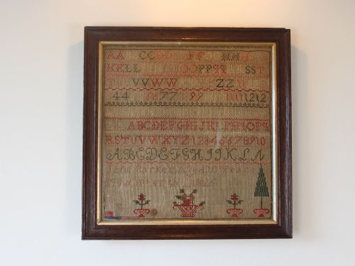 GEORGE IV NEEDLEWORK ALPHABET SAMPLER DATED 1825