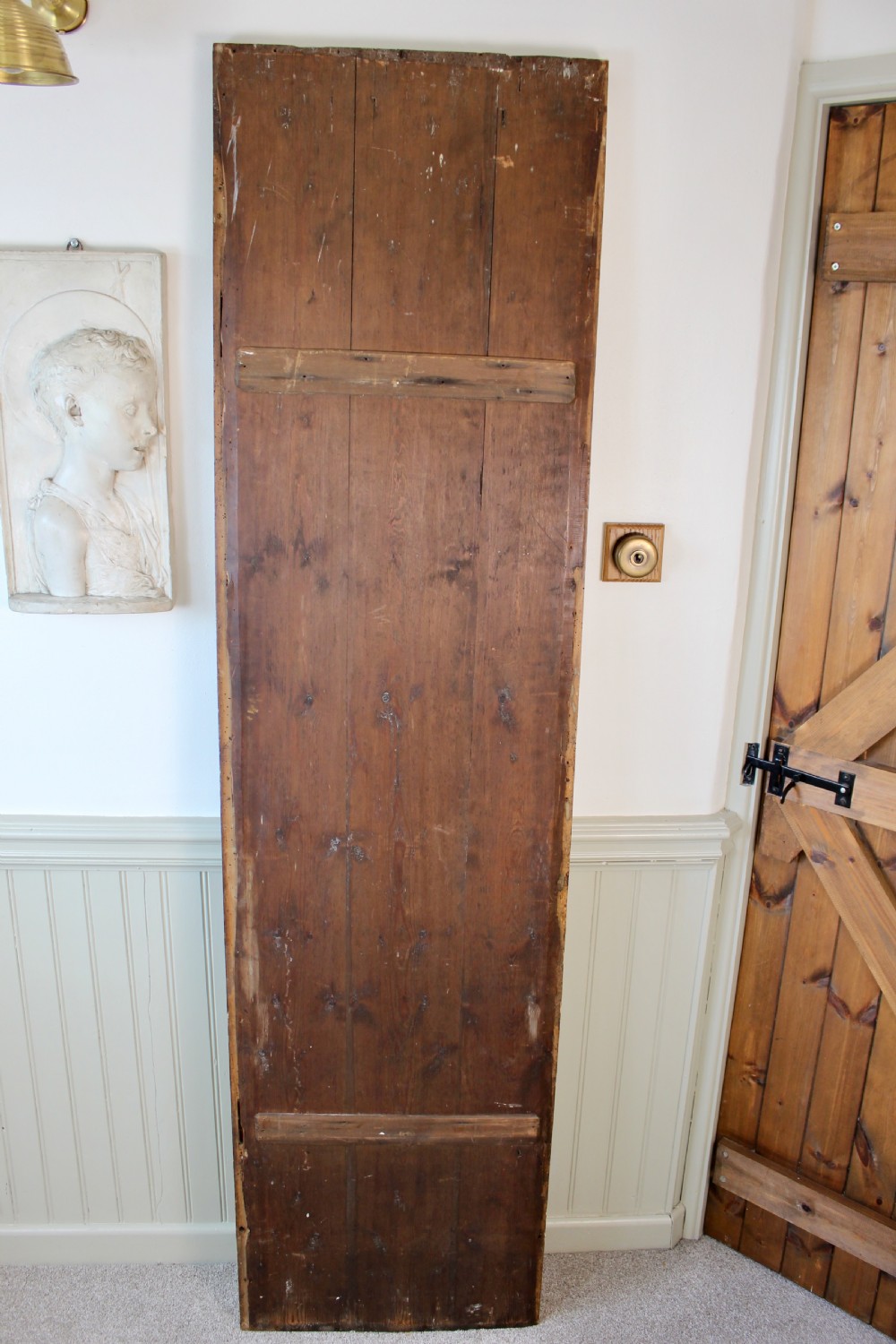 A tall rectangular antique giltwood pier mirror featuring rope-twist moulding and rosette corner blocks. View II