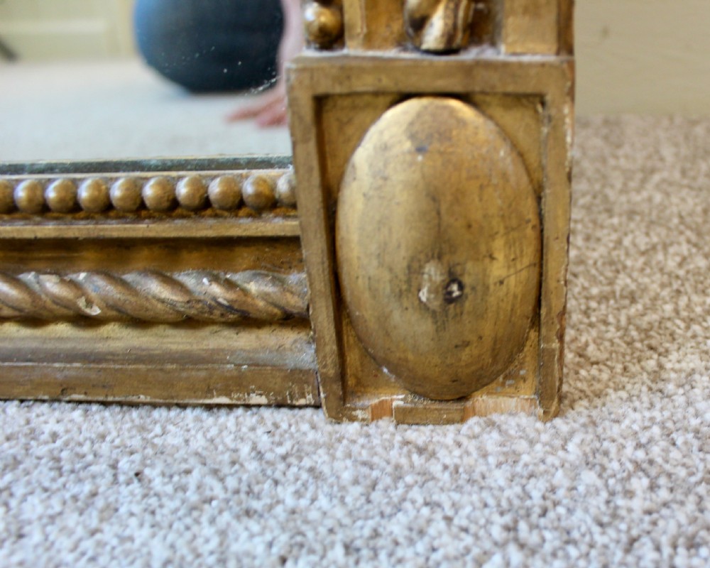 A tall rectangular antique giltwood pier mirror featuring rope-twist moulding and rosette corner blocks. View III