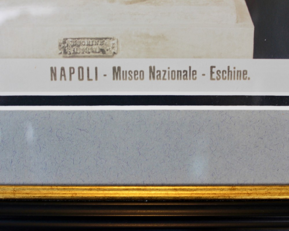 A pair of black and white framed photographic prints depicting ancient classical statues from the Naples National Archaeological Museum in dark stepped frames with gold accents. View V