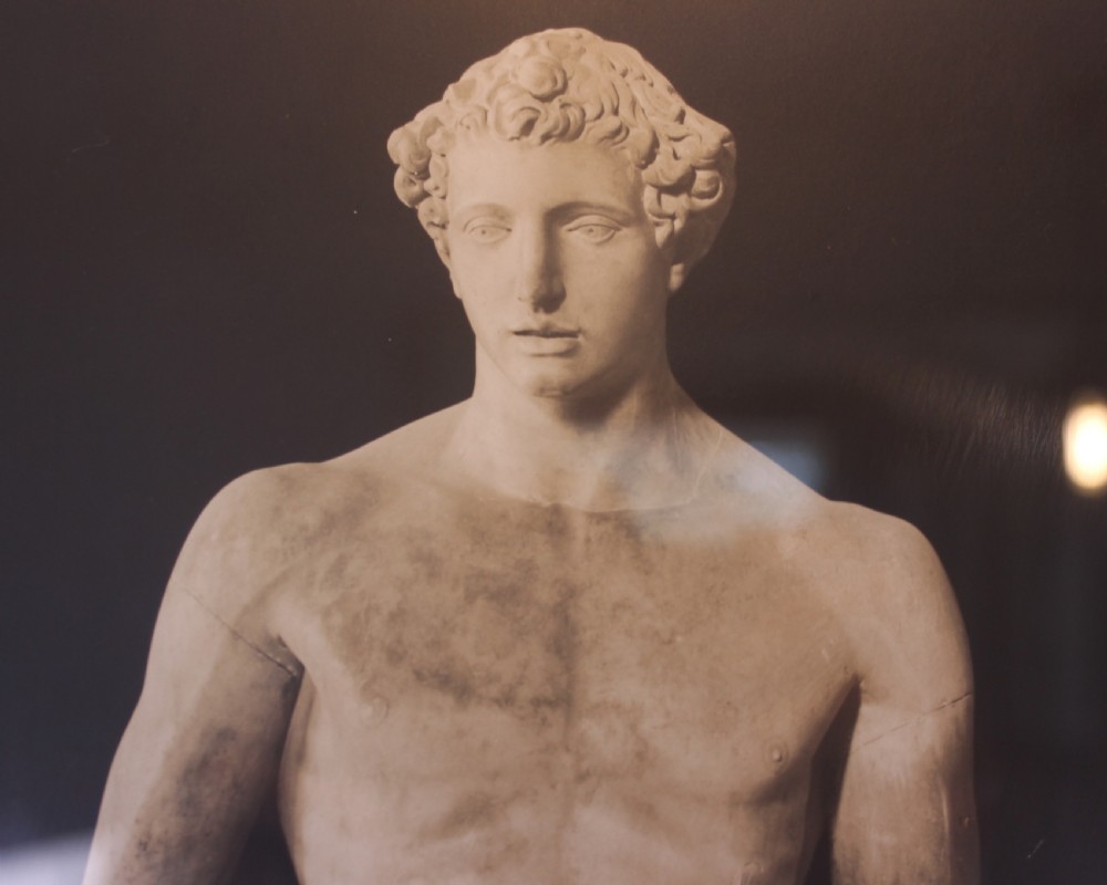 A pair of black and white framed photographic prints depicting ancient classical statues from the Naples National Archaeological Museum in dark stepped frames with gold accents. View IX
