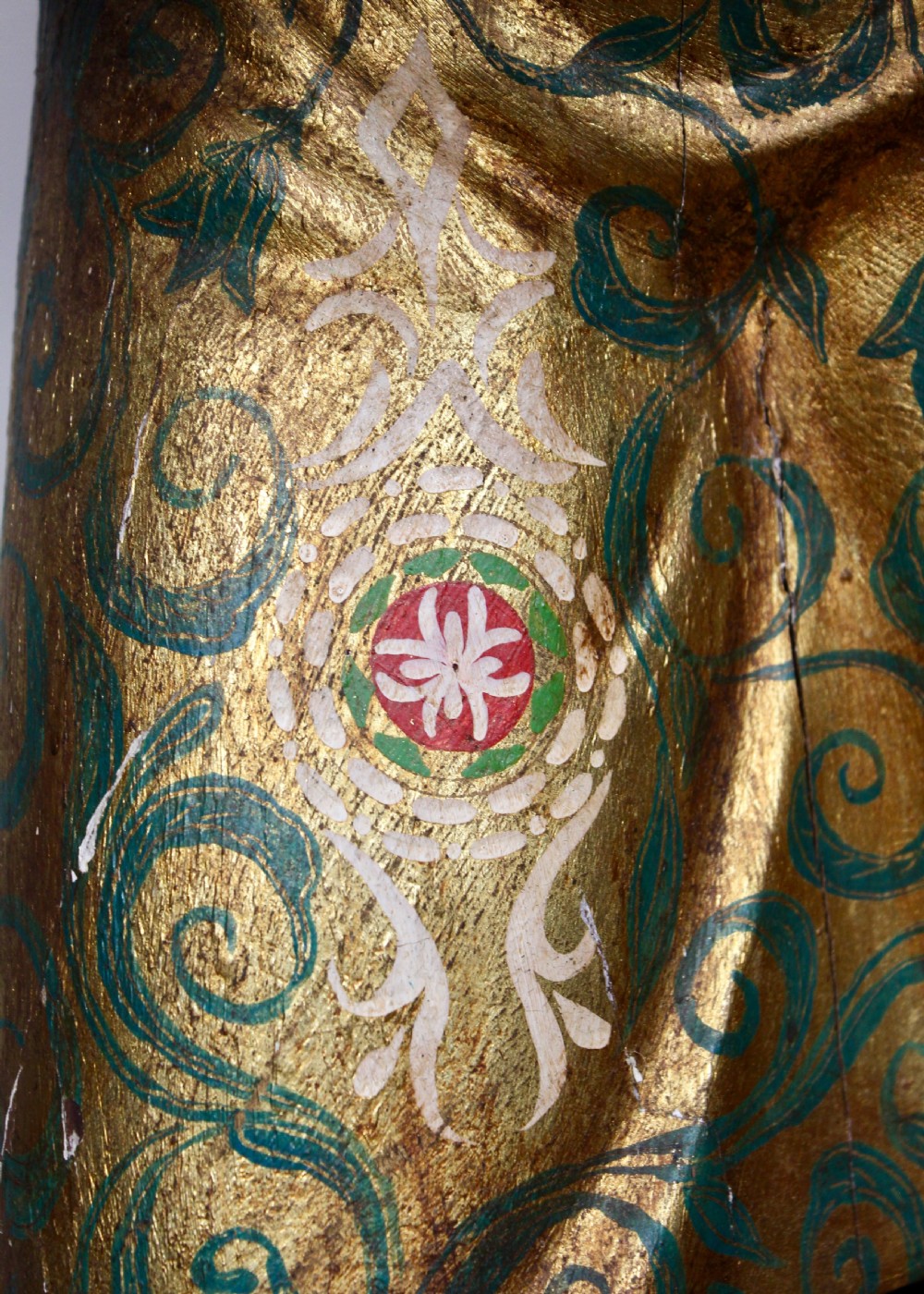 A carved wooden standing Venetian waiter figure wearing a decorated gold tunic and turban while holding a tray on a carved base. View VI