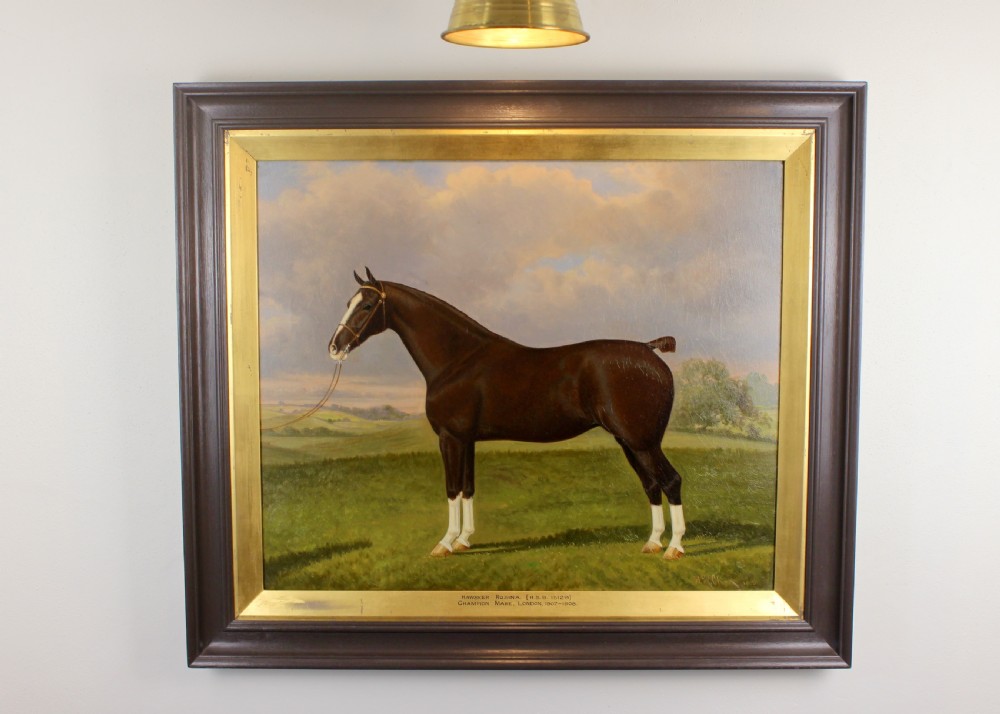 An antique framed oil painting depicting a dark brown Hackney horse standing in profile across a green pasture under a cloudy sky. View IX