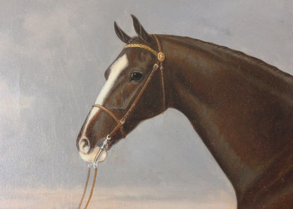 An antique framed oil painting depicting a dark brown Hackney horse standing in profile across a green pasture under a cloudy sky. View X