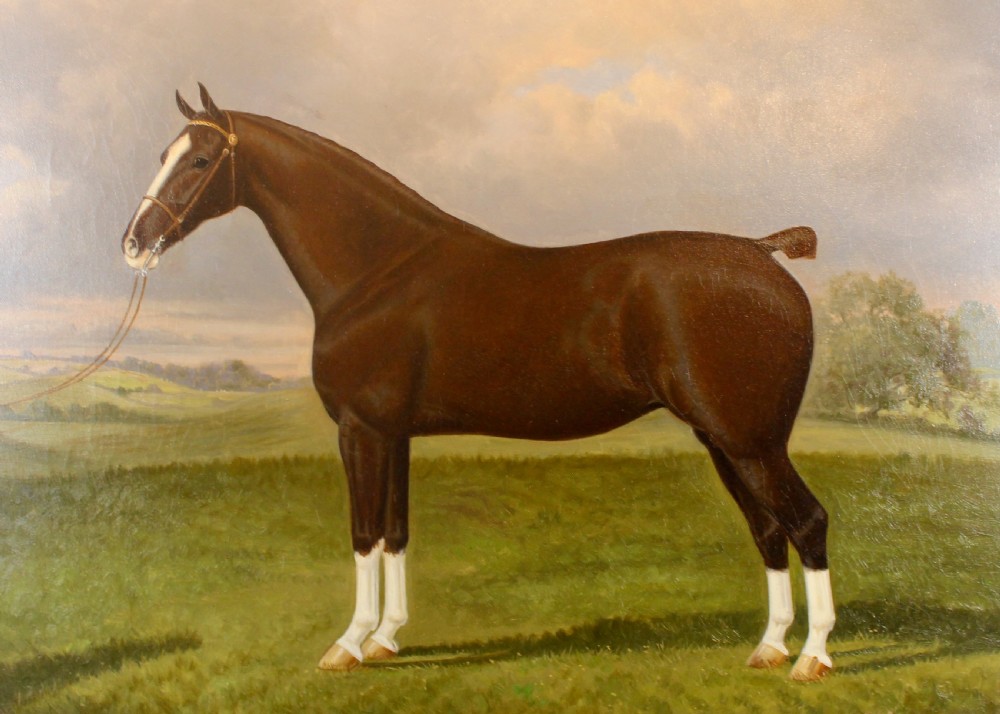 An antique framed oil painting depicting a dark brown Hackney horse standing in profile across a green pasture under a cloudy sky. View XI