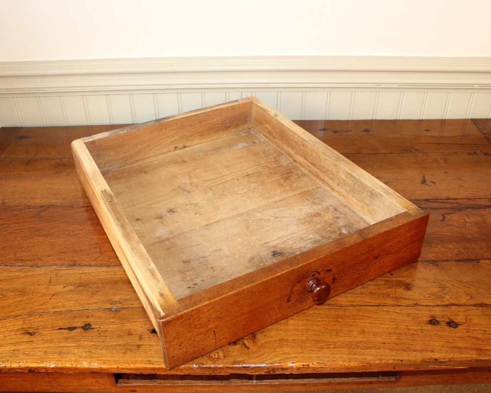 A 19th-century French provincial oak farmhouse table featuring a rectangular plank top, a single frieze drawer with a wooden knob, and four tapered square legs. View VII