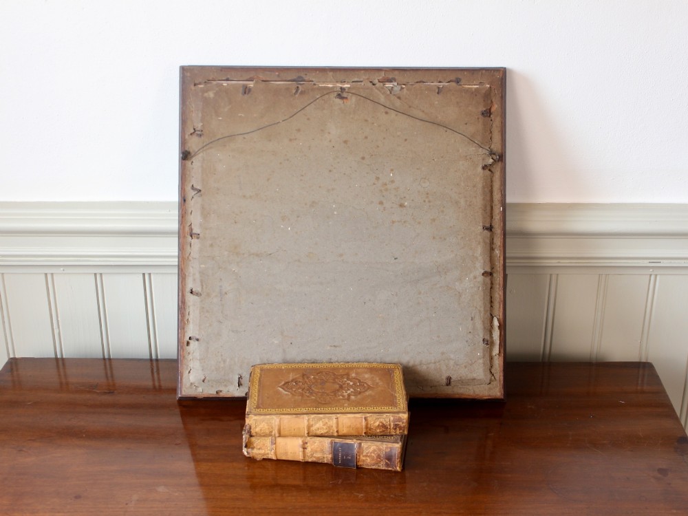 A framed 1825 Regency needlework alphabet sampler on linen fabric featuring embroidered rows of letters, numbers, floral motifs, and an inscription inside a dark timber frame. View VII