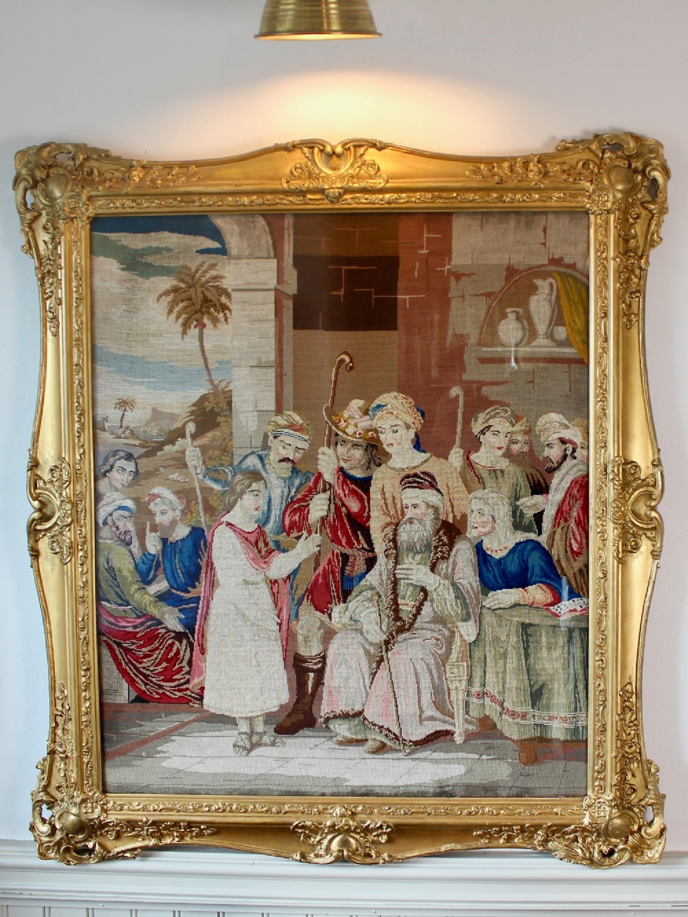 A large Victorian gilt-framed Berlin woolwork picture depicting a detailed biblical scene of Pharaohs dream with embroidered figures.