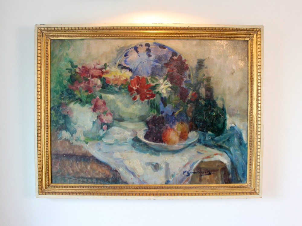 An impressionist still life oil painting on canvas depicting flowers and fruit in ceramic vessels, set within a beaded gilt wooden frame. View II