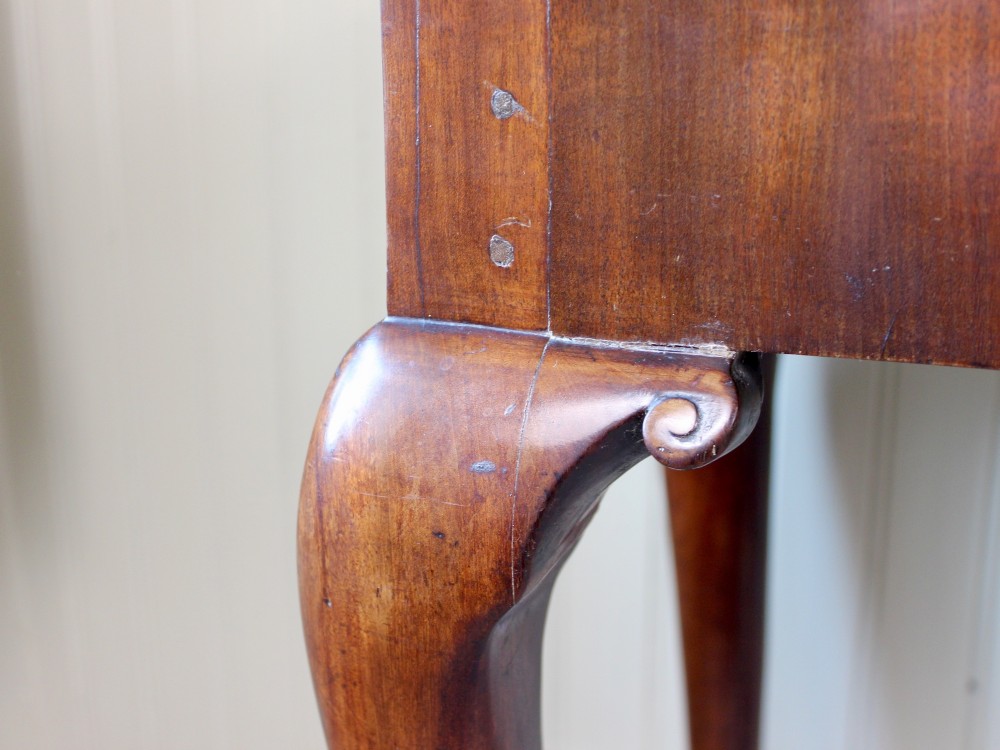 A George III mahogany fold-over card table featuring cabriole legs terminating in ball and claw feet alongside a central frieze drawer. View XII