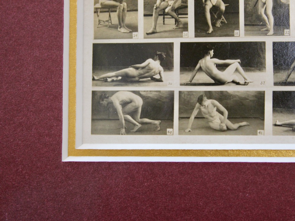 A framed 1920s monochrome photographic contact sheet displaying multiple male nude poses, mounted on burgundy card within a dark timber frame with gilt detailing. View VIII