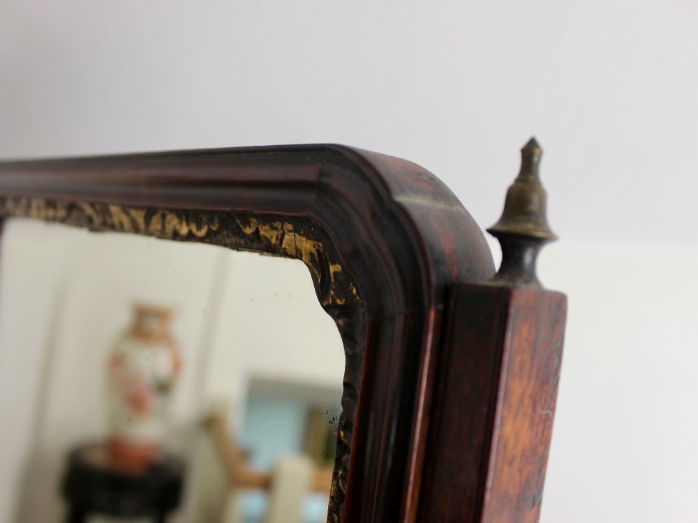 A George II mahogany dressing mirror featuring a swivel glass plate with a parcel-gilt frame resting on a three-drawer base. View VI
