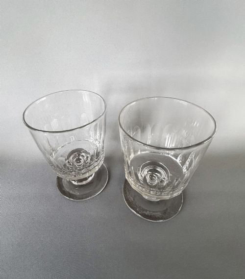 fig 1. A pair of clear glass Georgian rummers featuring cut fluted bowls, knopped stems, and flat circular bases.
