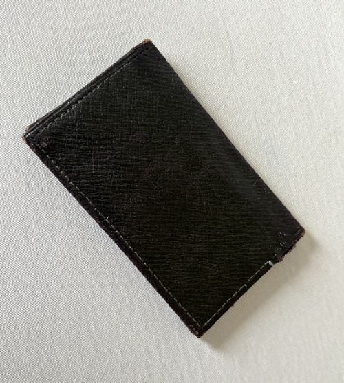 A small dark brown textured leather stamp wallet featuring a hallmarked sterling silver monogram mount shaped as the letter B. View III
