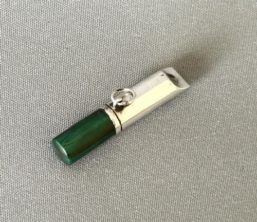 fig 1. A Victorian silver whistle with a cylindrical polished green malachite handle and a silver suspension ring.
