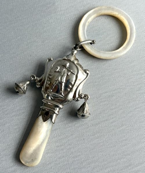A Delightful Silver & Mother-of-pearl Peter Pan Rattle