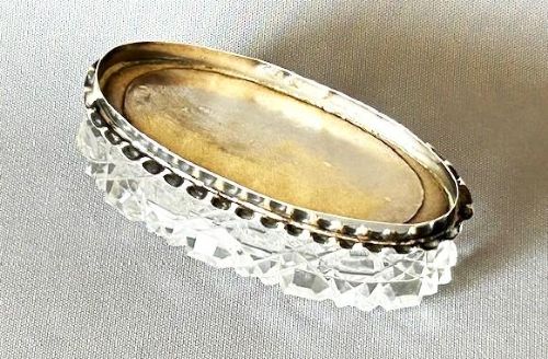 An oval Edwardian cut glass trinket box featuring an engraved sterling silver lid inset with green Connemara marble shamrock shapes. View III
